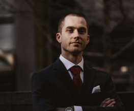 man wearing black notched lapel suit jacket in focus photography